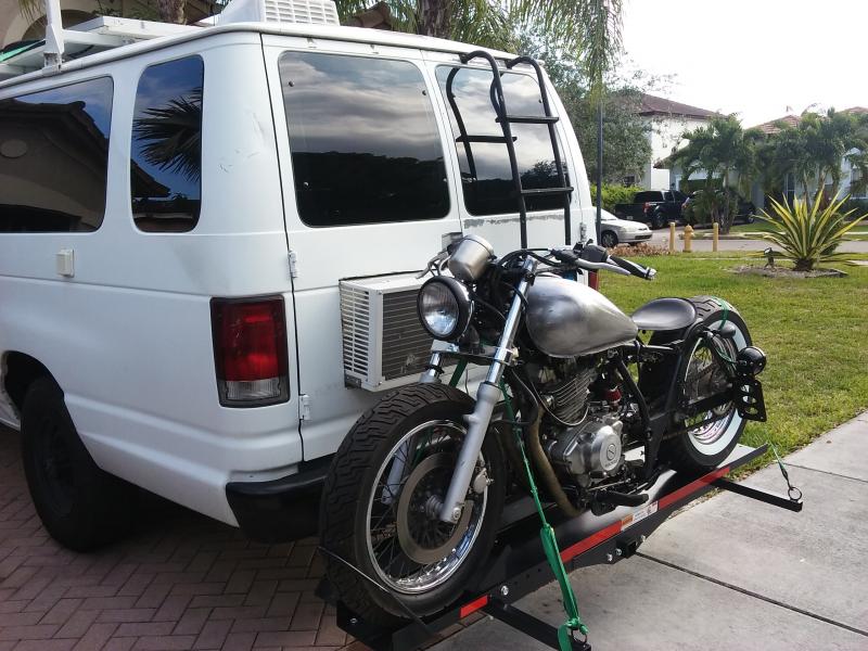 On the bike rack, ready for travel.