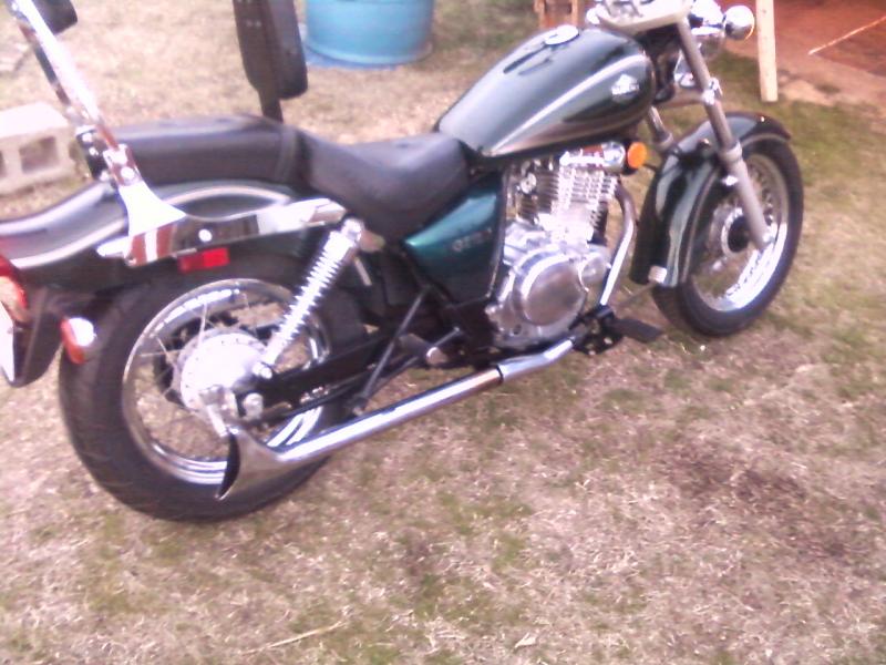 Suzuki gz250 2001 with fishtail exhaust pipe.